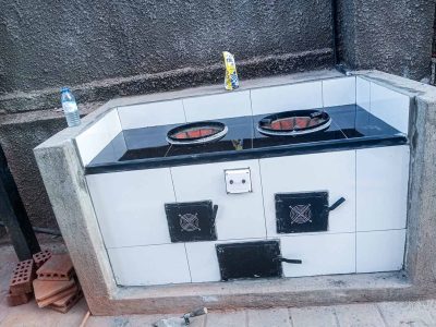 Two-burner volcanic rock outdoor kitchen installed by Beta Kitchens Uganda